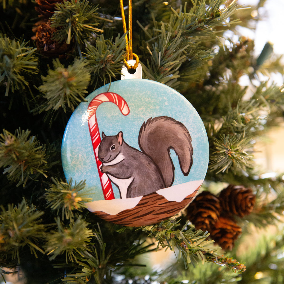 Squirrel Holding a Candy Cane Christmas Ornament