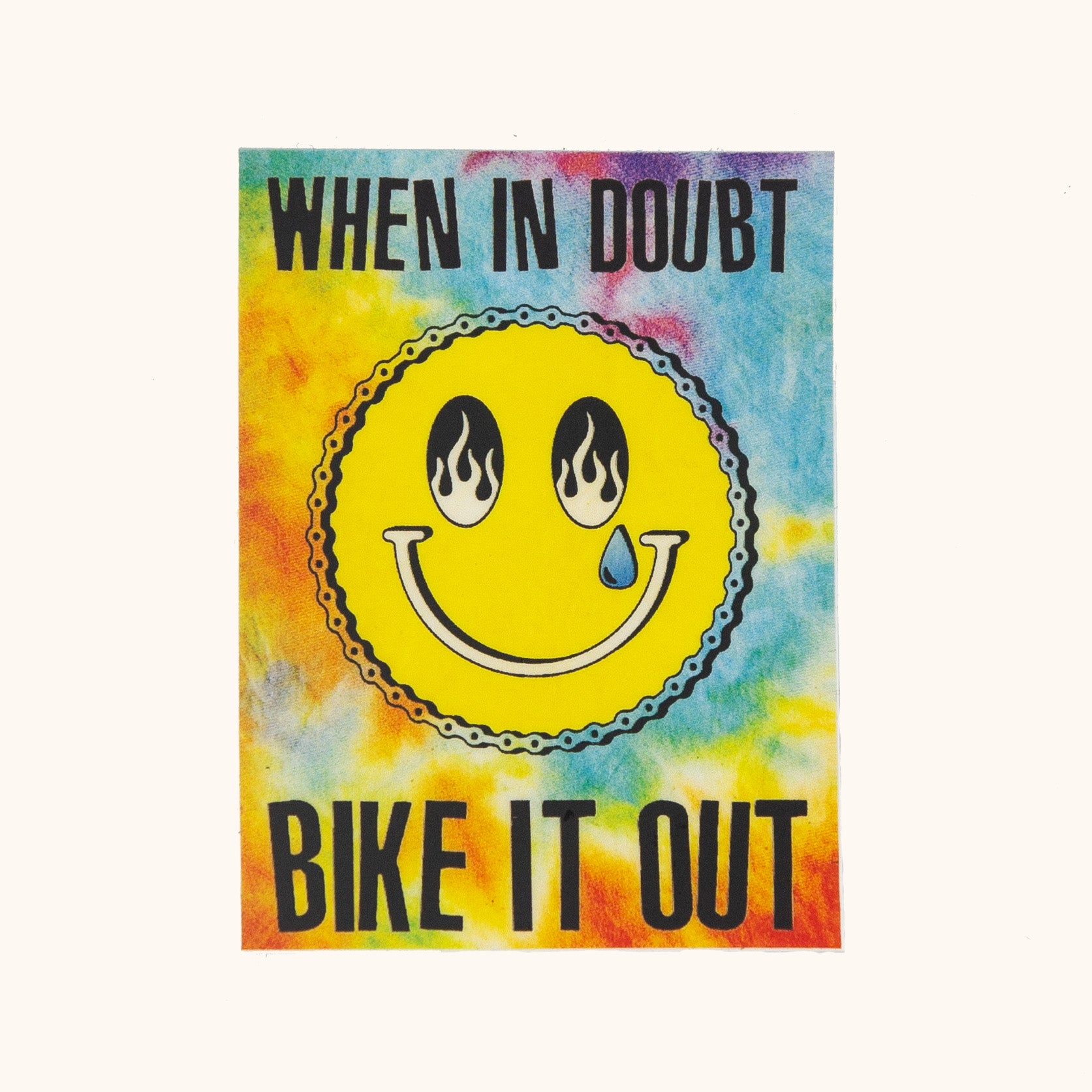Colorful tie-dye poster with a smiley face and text 'When in doubt, bike it out' on a white background.