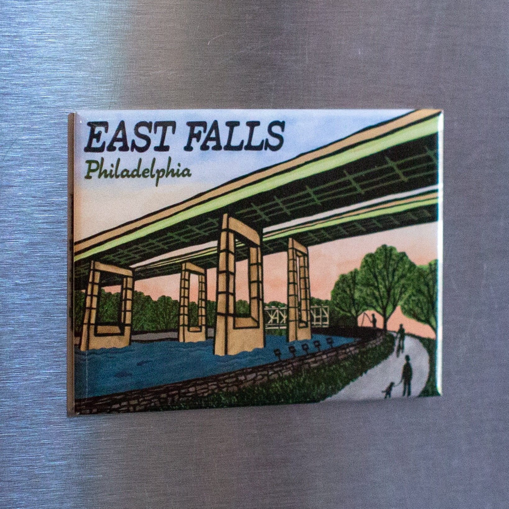 Fridge magnet with 'East Falls Twin Bridges Philadelphia' design on a metallic surface