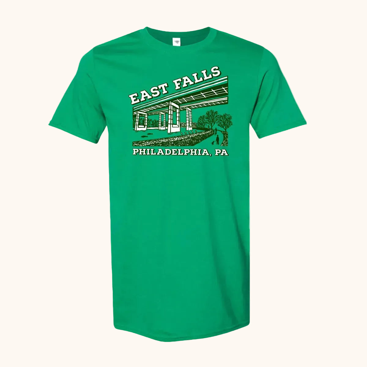 A green short-sleeve crewneck t-shirt featuring a vintage-style graphic of East Falls Twin Bridges with 'EAST FALLS' and 'PHILADELPHIA, PA' printed in white and dark green.