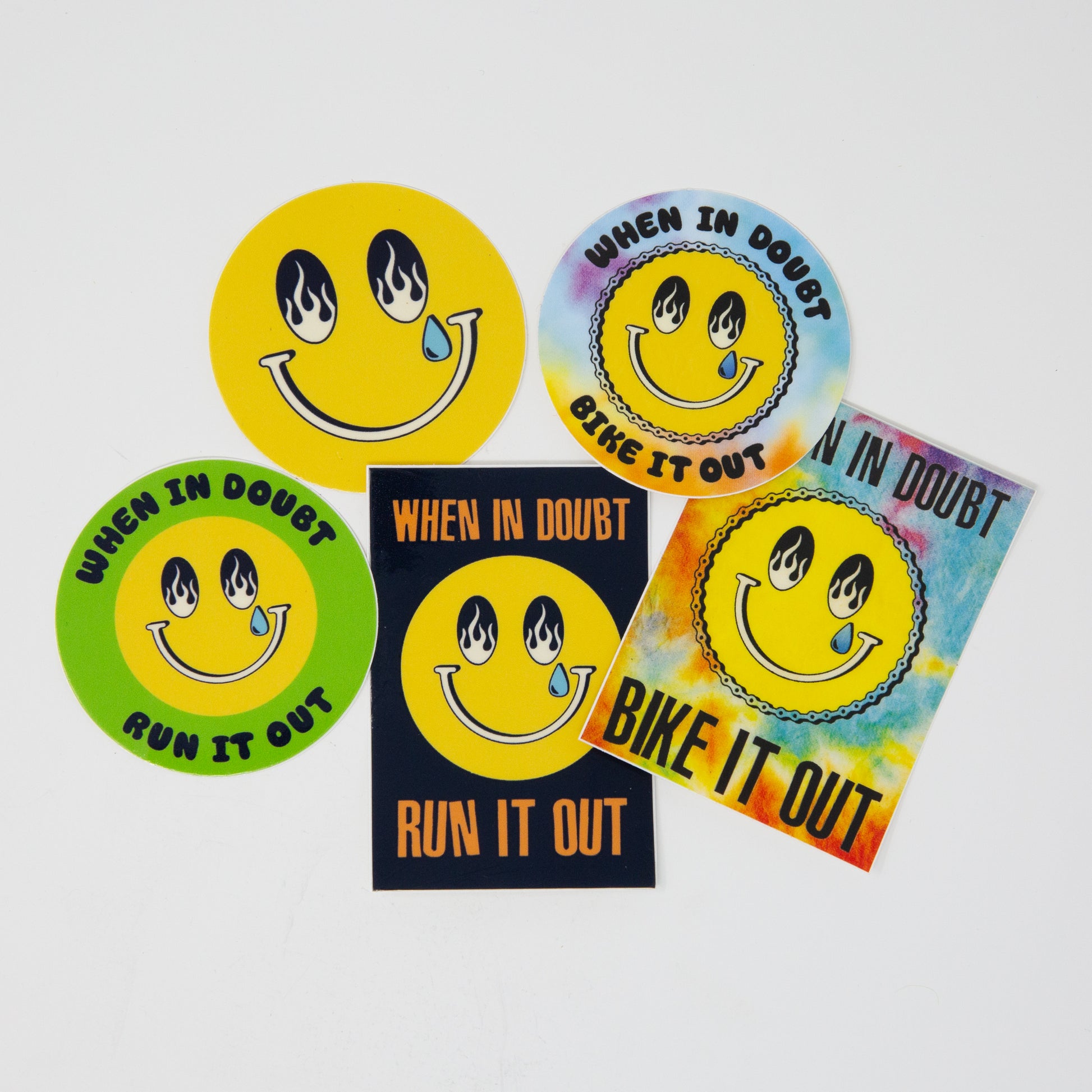 Set of colorful stickers with smiley faces and text on a white background