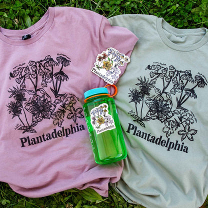 Two t-shirts, magnet, and sticker with 'Plantadelphia' branding