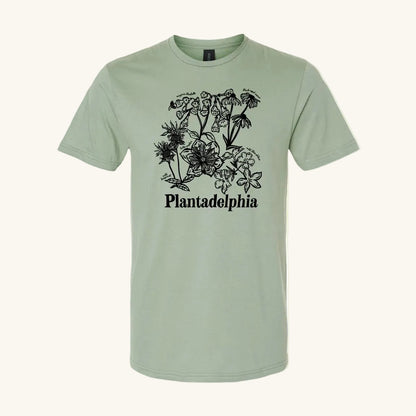 light green t-shirt with black floral design and 'Plantadelphia' text on a yellow background