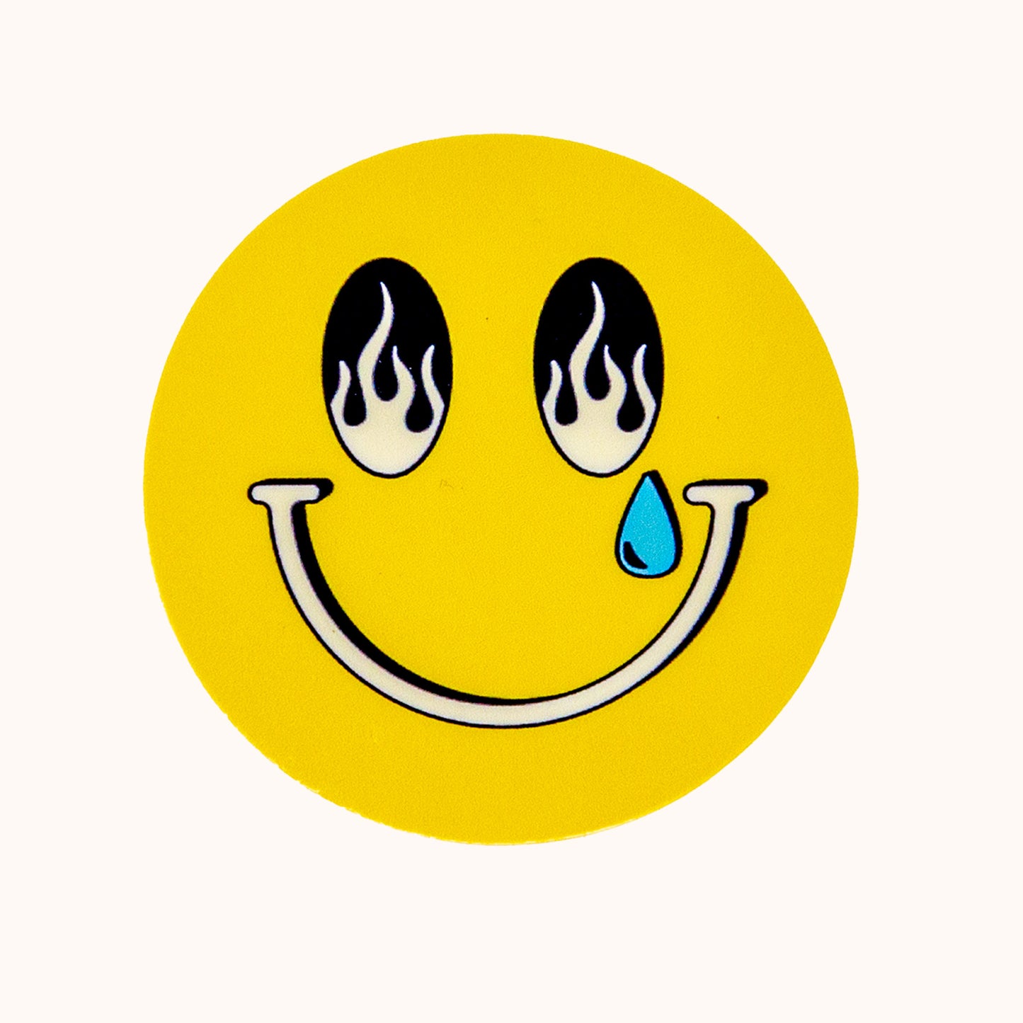 Smiley face with flames for eyes and a blue teardrop on a yellow background