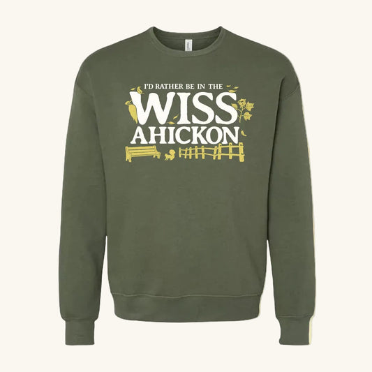 Green sweatshirt with 'I'd Rather Be in the Wissahickon' text on a beige background