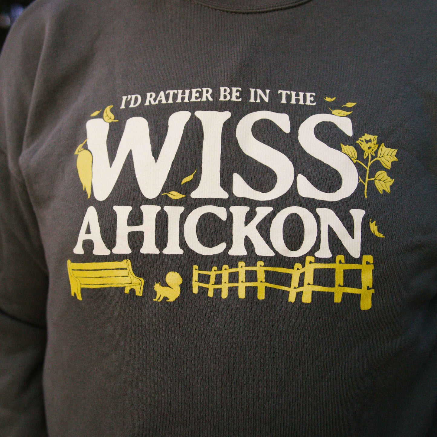 Olive crewneck with 'I'd Rather Be In The Wissahickon' text and graphics.